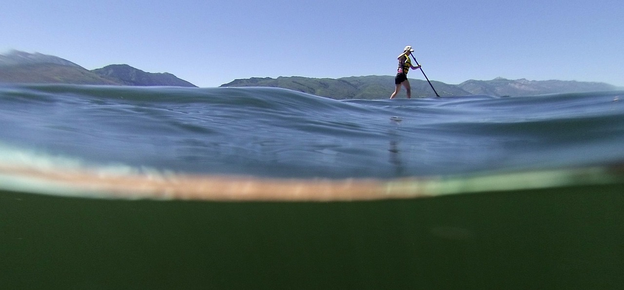 An inflatable stand up paddle board on the water